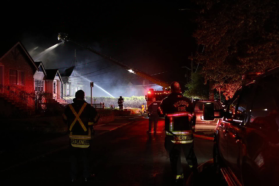 Fire crews working to put out a fire in the 200-block of Robert Street that started at around 8:40 p.m. on April 28. (Kendra Crighton/News Staff)