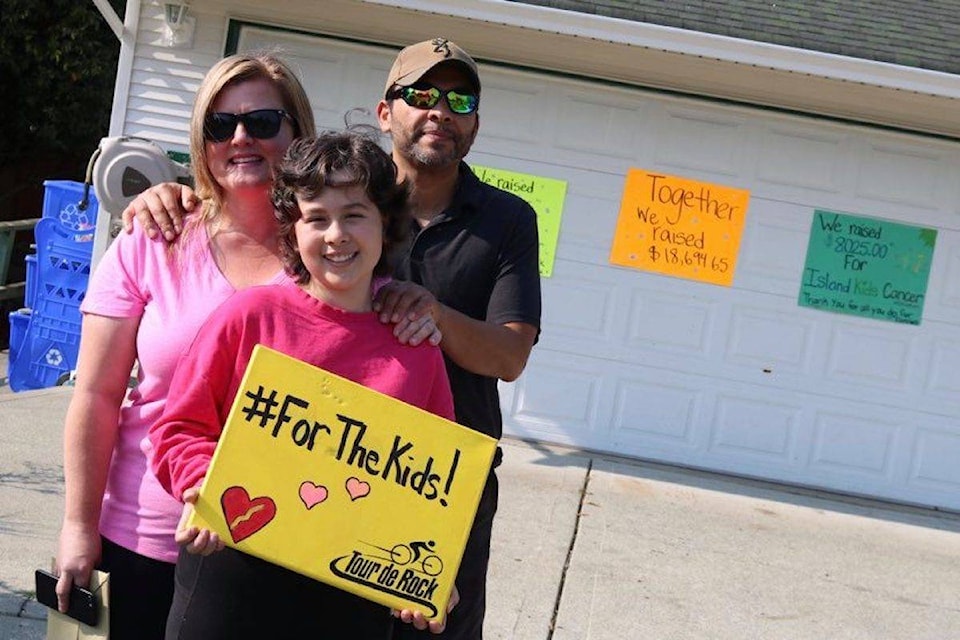 Meredith, left, Lily and Jose Lecinana received a visit from the Tour de Rock riders after 11-year-old Lily raised more than $10,000 with a bottle drive. Lily is 10 months into remission after fighting stage four Burkitt’s leukemia. (Aaron Guillen - Sooke News Mirror)