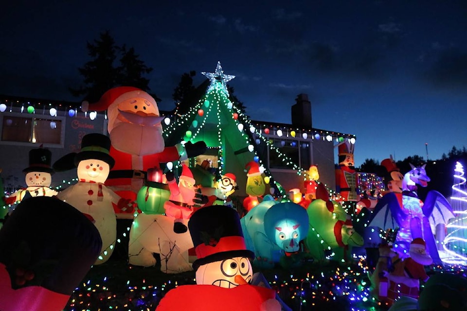 A Colwood couple has set up over 140 Christmas inflatable decorations around their property at 555 Girdou Rd. The home is lit with Christmas music playing from 3 p.m. to 8 p.m. Sunday through Thursday and 3 p.m. to 11 p.m. Friday and Saturday. (Aaron Guillen/News Staff)