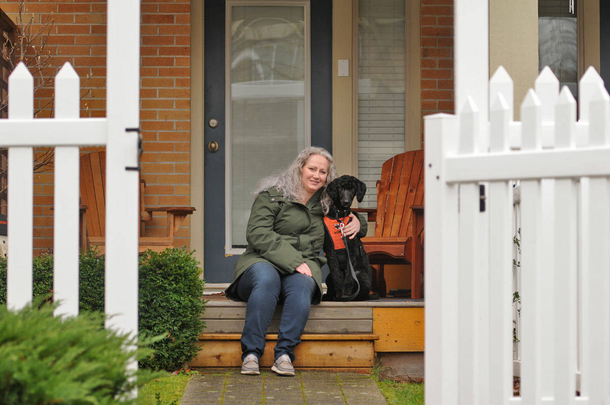 Sharon Lambert, seen here with service dog Toby on Dec. 11, 2020, has set up a fundraiser to help pay for the costs of training him and so he can hopefully live with her full-time. (Jenna Hauck/ Chilliwack Progress)