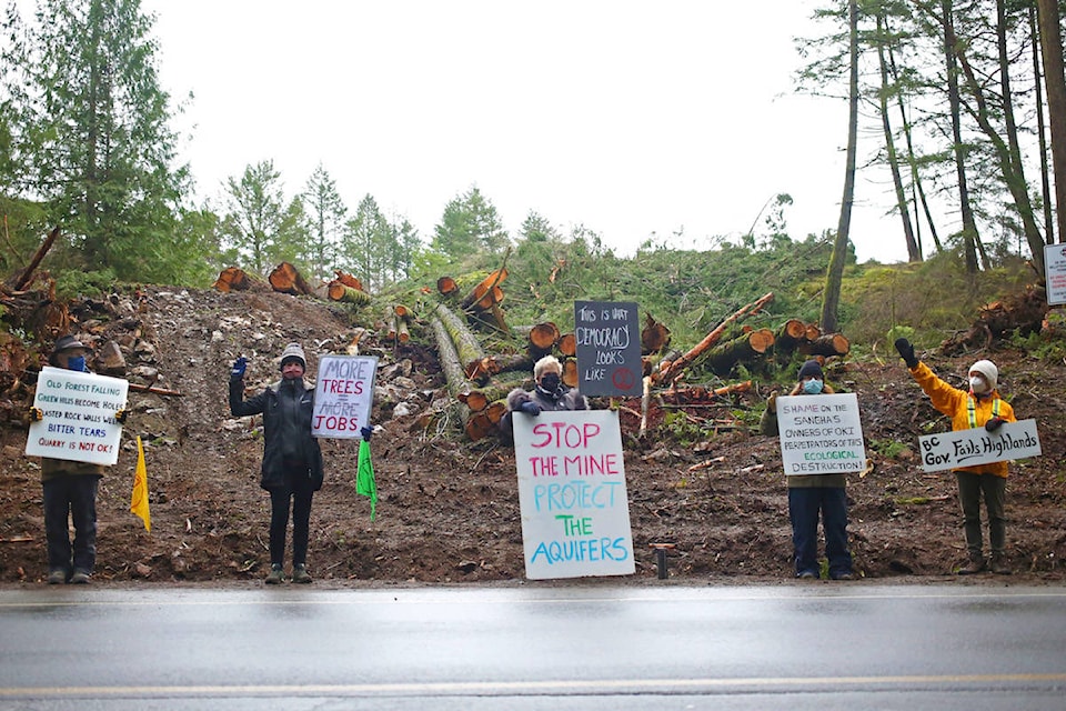 Highlands residents protest outside the O.K. Industries’ work site along Millstream Road on Thursday, Feb. 4. The protesters would like to see a reform of the B.C. Mines Act. (Dawn Gibson/News Staff)