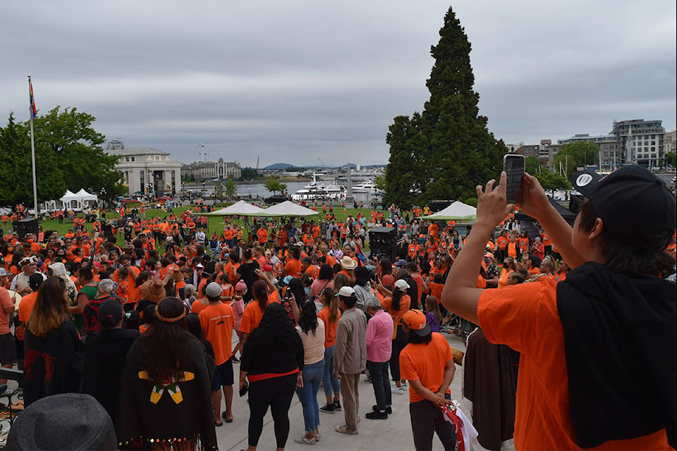 The crowd gathered outside the BC Legislature building on July 1, 2021. (Kiernan Green / Victoria News Staff)