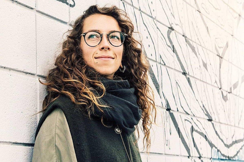 Muralist Lydia Beauregard poses with her work. The Esquimalt Community Arts Hub hopes to unite the township’s community via the festival. (Courtesy of Laura-Beth Keane/Esquimalt Community Arts Hub)