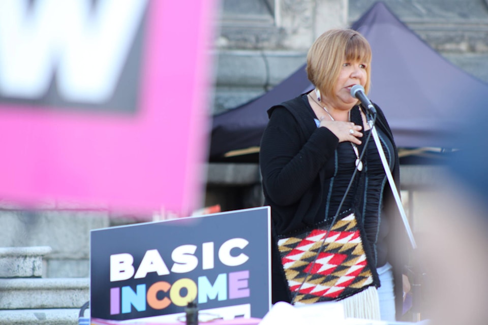 Diana Day, lead matriarch of the Pacific Association of First Nations Women, speaks at an event calling for basic income outside the B.C legislature on Sept. 25 (Jake Romphf/News Staff)