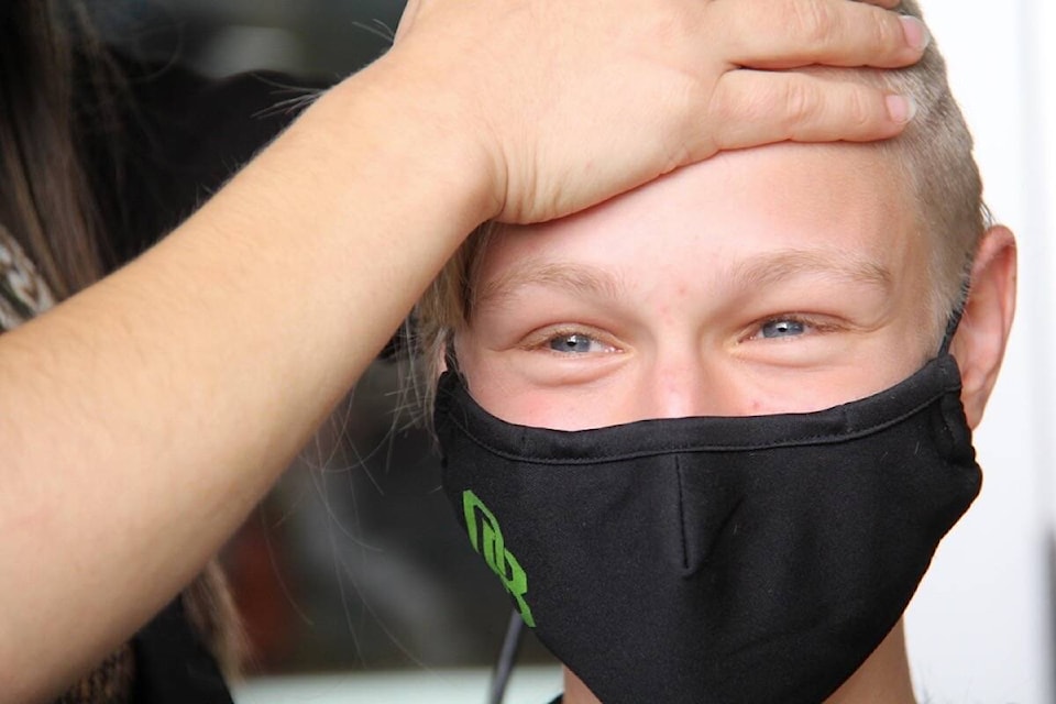 Oak Bay High student Annika Bergemann goes for the short look to raise funds for the Canadian Cancer Society. (Christine van Reeuwyk/News Staff)