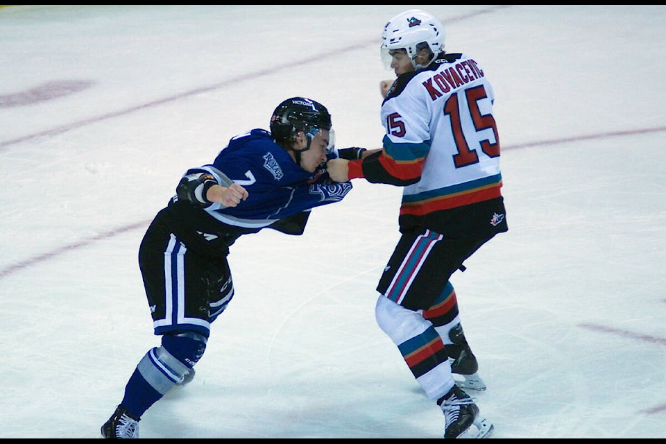 Royals defenceman Devin Aubin and Rilen Kovacevic dust it up after a flurry of second-period goals by the Royals. One of two fights in the game. (Christopher Kelsall/Special to Victoria News)