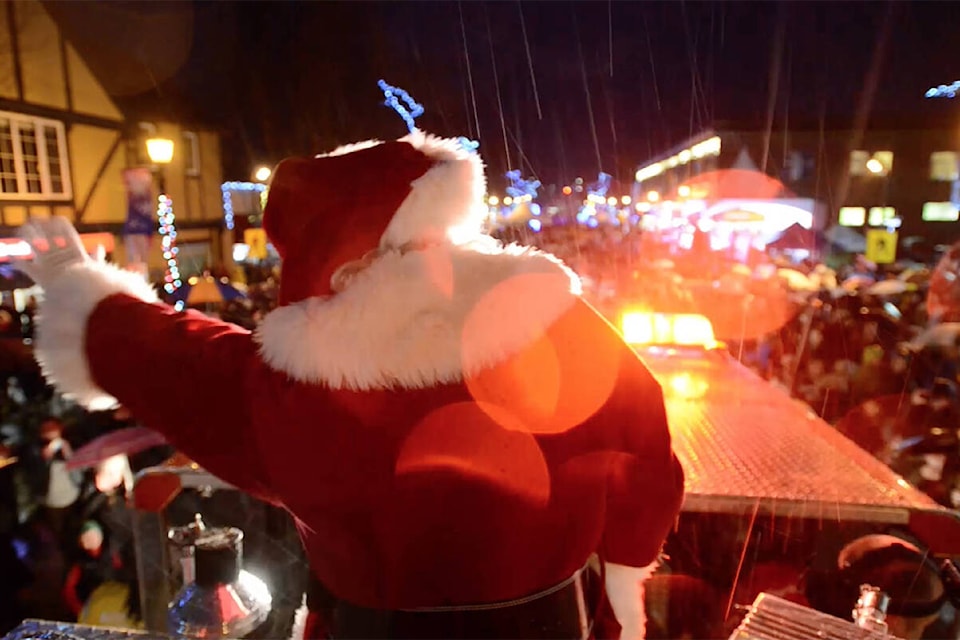 Santa traditionally rides in to Oak Bay village atop a fire truck. (Black Press Media file photo)