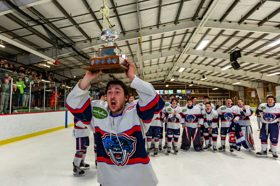 Panther Kyle Brown lifts the Brent Patterson Memorial Trophy after the Peninsula Panthers came from behind to win Game 6 against the Oceanside Generals 4-3 in overtime Friday night. (Courtesy Christian J. Stewart Photography)