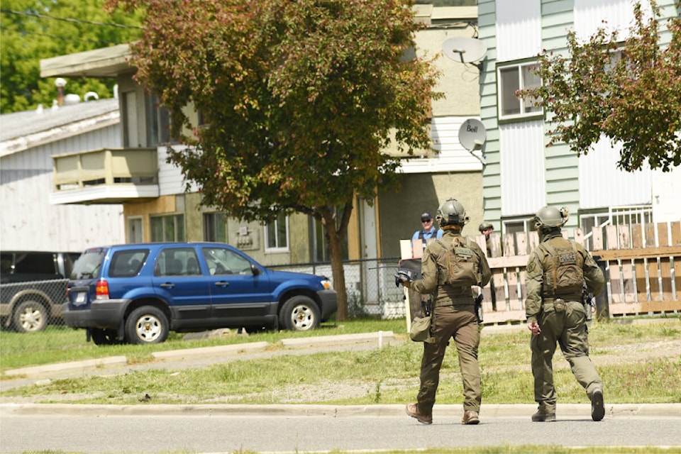 ERT members from Prince George bring in a drone to assess the scene inside a building in the 300 block of Ninth Avenue. (Ruth Lloyd photo - Williams Lake Tribune)