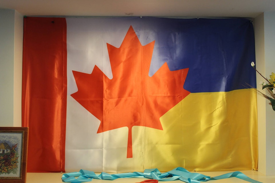 A Canadian and Ukrainian shared flag inside the village’s common meeting area. (Austin Westphal/News Staff)