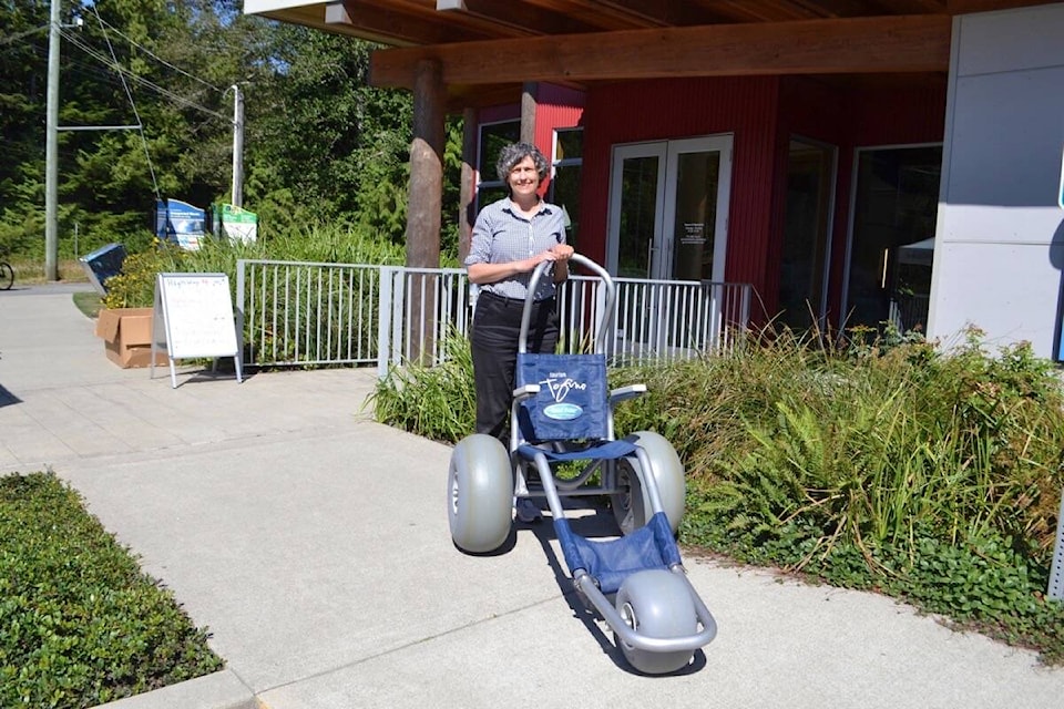 Jody Kirk, Tourism Tofino’s visitor and member services manager, says the beach wheelchairs are easy to assemble and easy to manoeuvre. (Nora O’Malley photo)