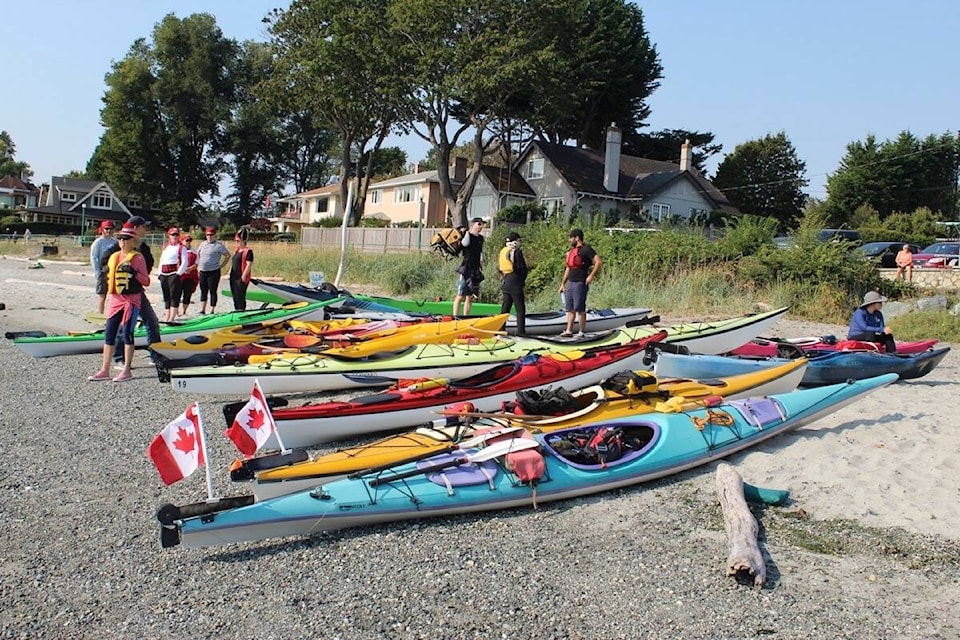 Kayaks and canoes were scattered all around Willows Beach on Saturday (Sept. 10) before paddlers took to the water. (Austin Westphal/News Staff)