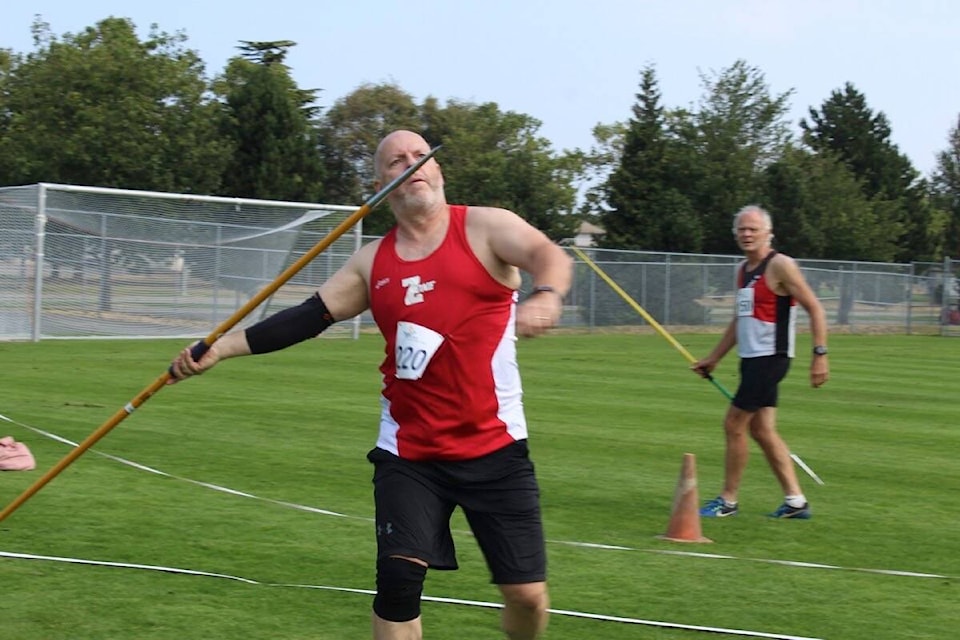 Mike Dailey, 59, attempts his third and final javelin throw in the men’s track and field pentathlon event. (Austin Westphal/News Staff)