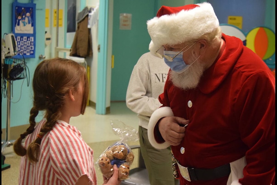 Santa delivers gifts at Victoria General Hospital. (Brendan Mayer/News Staff)