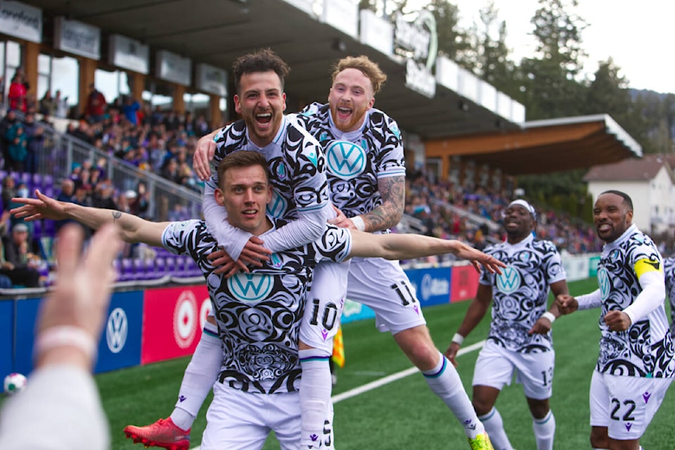 Pacific FC players celebrating a goal during their game against Forge FC on April 10. The game was the first time they wore the alternate jersey, designed by Coast Salish artist Maynard Johnny Jr. (Justin Samanski-Langille/News Staff)