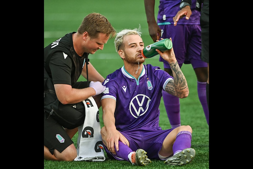 Marco Bustos takes on water during Pacific FC’s playoff game against Atletico Ottawa at Starlight Stadium in Langford on Sunday (Oct. 16). (Simon Fearn/Black Press Media)