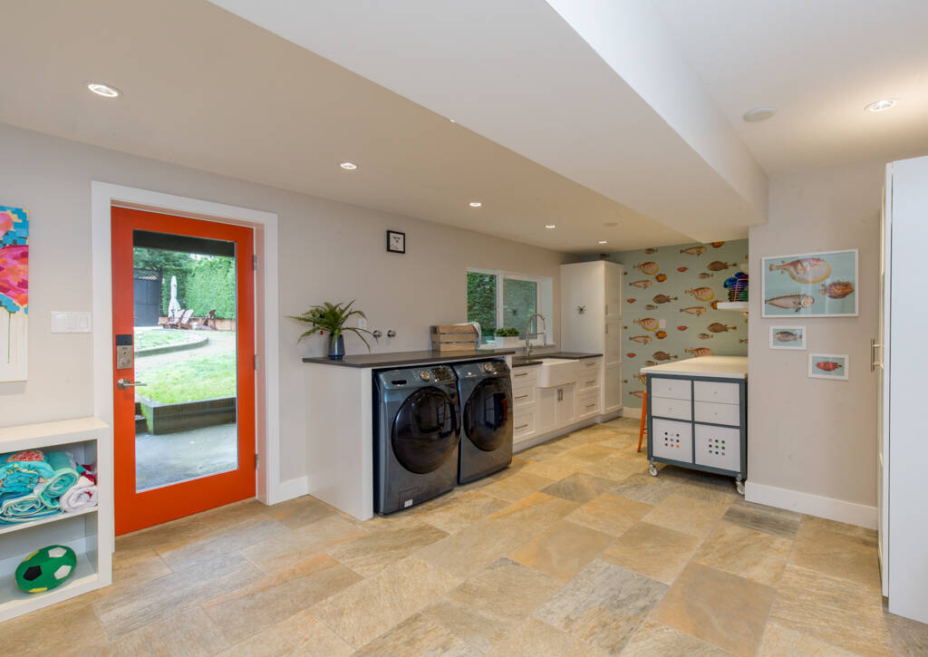 Goodbye dreary basement laundry! This space shows how the right design can make a basement bright and beautiful. MAC Renovations photo