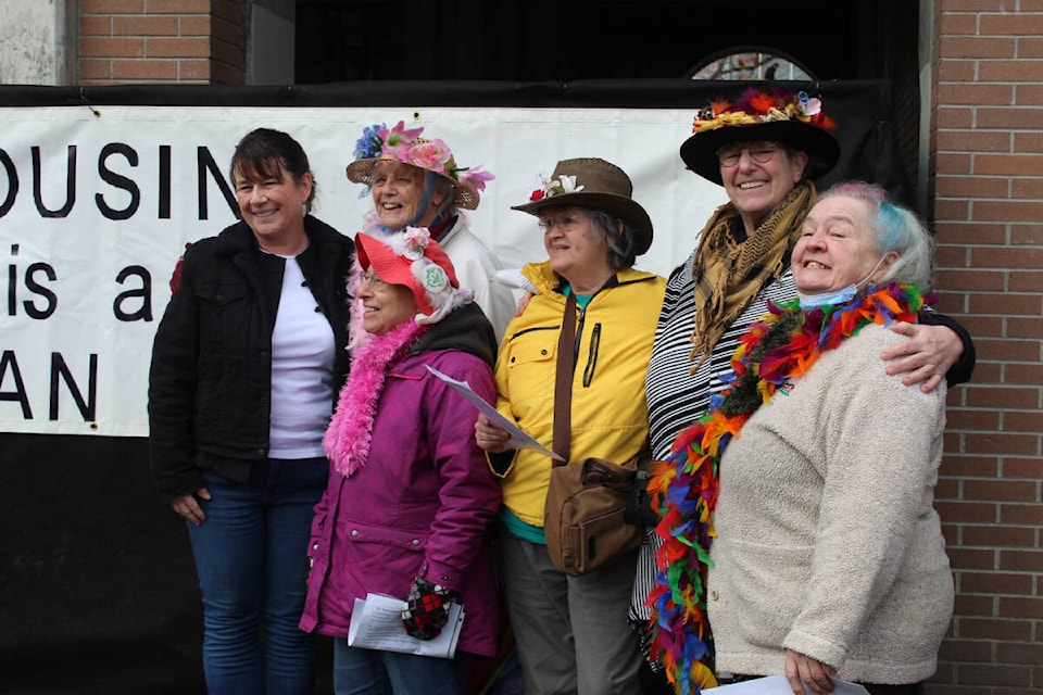 Niki Ottosen poses with the Raging Grannies, who performed a few songs during the rally. (Hollie Ferguson/News Staff)