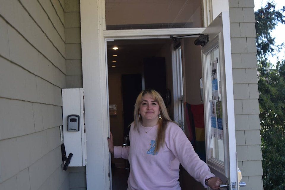 The manager of Threshold’s Supportive Recovery Program, Kacie Stirrett opens the door to the house to show off the home’s common areas. (Hollie Ferguson/News Staff)