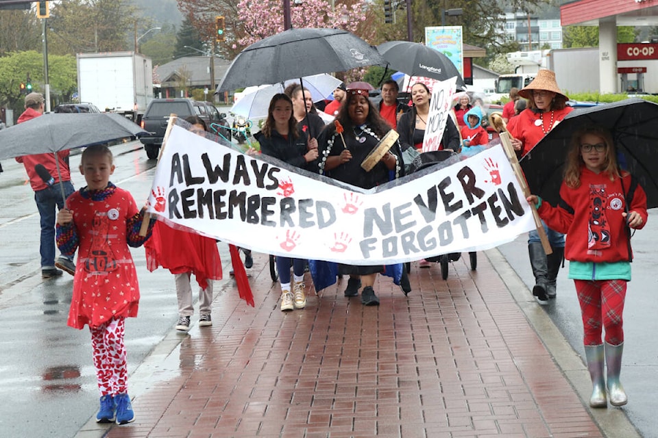 Students from three Langford schools marched along Goldstrem Avenue for Red Dress Day. (Bailey Moreton/News Staff)