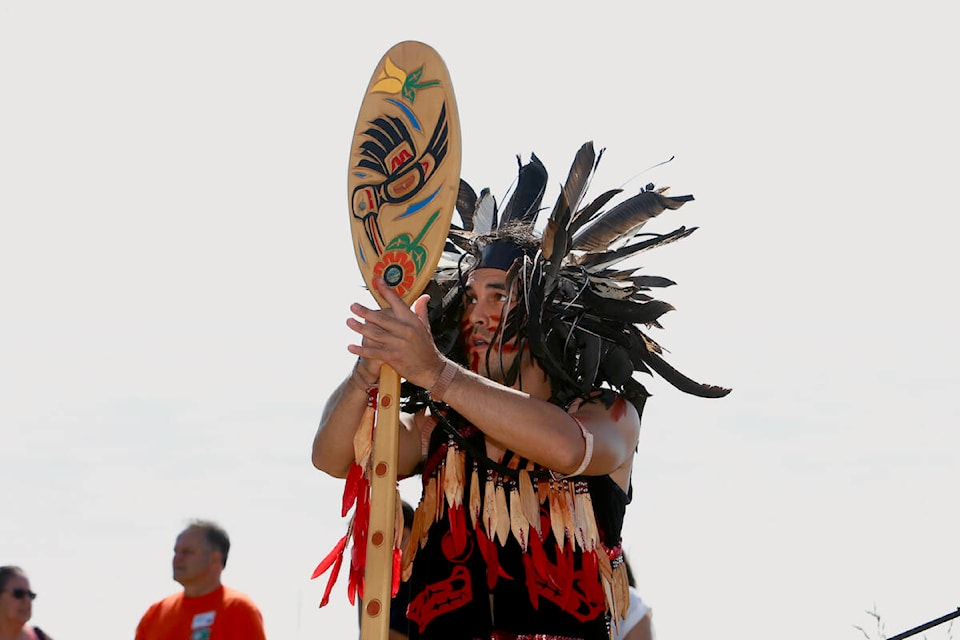 A Lekwungen Dancer performs ahead of the Canoe Landing Protocol Wednesday, June 21 during National Indigenous Peoples Day celebrations at Royal Roads University. (Justin Samanski-Langille/News Staff)