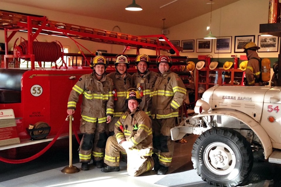 Firefighters in 2015 enjoy the exhibition at the Colwood Firefighter's Historical Museum.