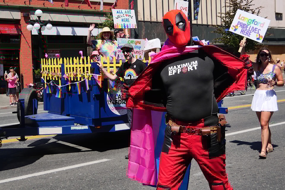 Deadpool, Langford Coun. Mary Wagner and Colby Harder enjoy the parade.