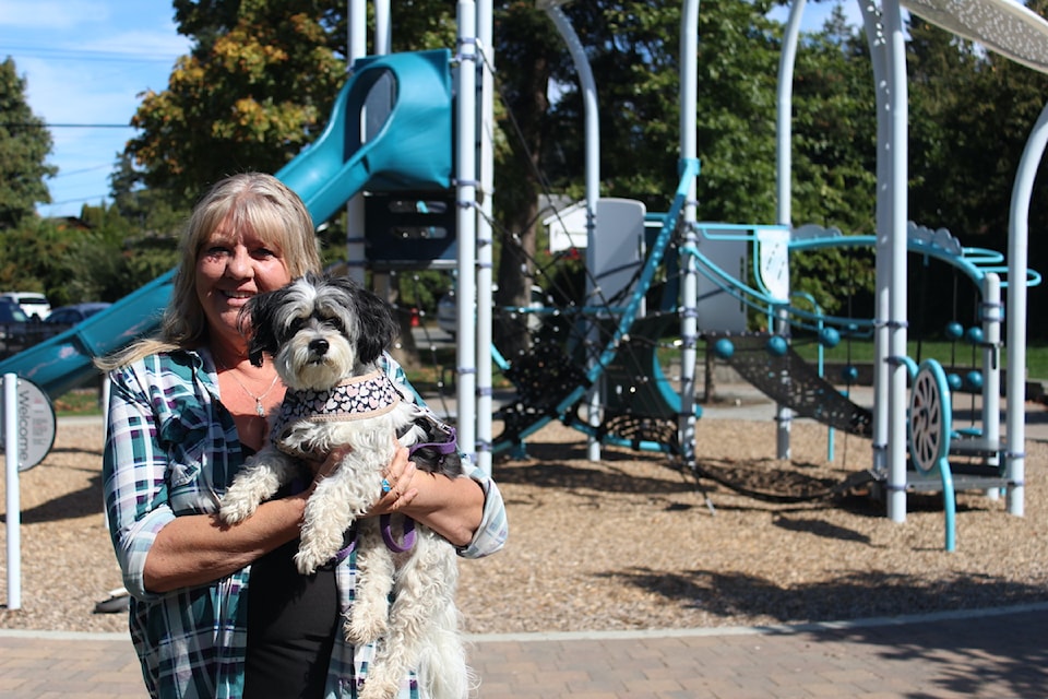 Daughter of Winnie Sifert, Sandy, with her dog in Ernhill Park, the park she hopes will one day be named after the former councillor.