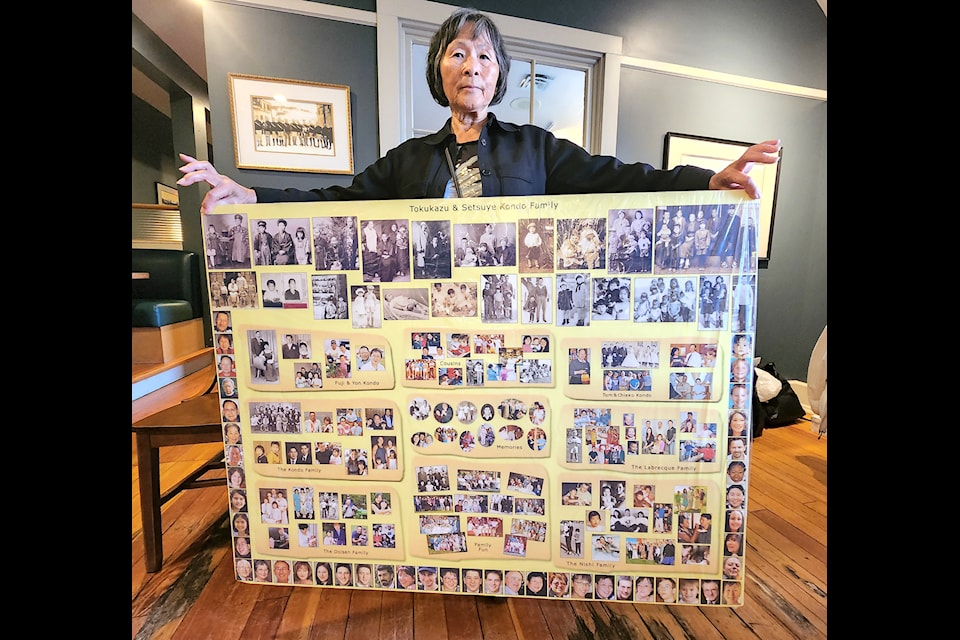 
Yoko Nishi shows a poster of her family's history as seen in photos, showing the many branches and relations her family has developed from more than 120 years.

This image of a copy of the photo album from 1946 that touched off the international search for connections between Grand Forks and Mio, Japan, shows aspects of life for Japanese Canadians in Grand Forks, including farming.