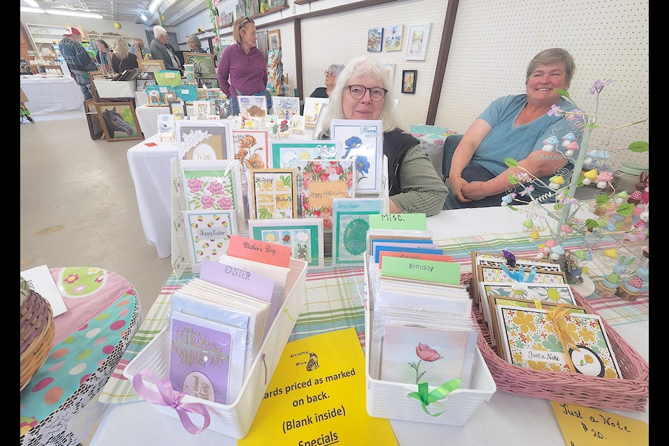 Carol Fischer, left, Kettle River Art Club member and proprietor of Crafty Fox and Heidi McIvor, club member and member of the Dog Patch Collective, were sharing a table, selling handmade greeting cards and Easter-themed crafts, including small Easter bunnies and small painted artificial eggs. 