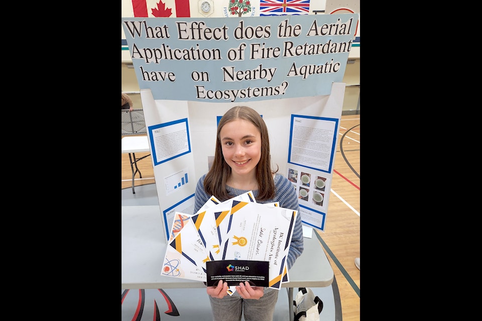 Sadie Bruen, 15, from Trafalgar Middle School in Nelson, shows off her awards for her project on how fire retardant affects water ecosystems. She was one of a few competitors in the West Kootenay Regional Science Fair at Hutton Elementary on Saturday. This was the first time the fair was held at Hutton. 