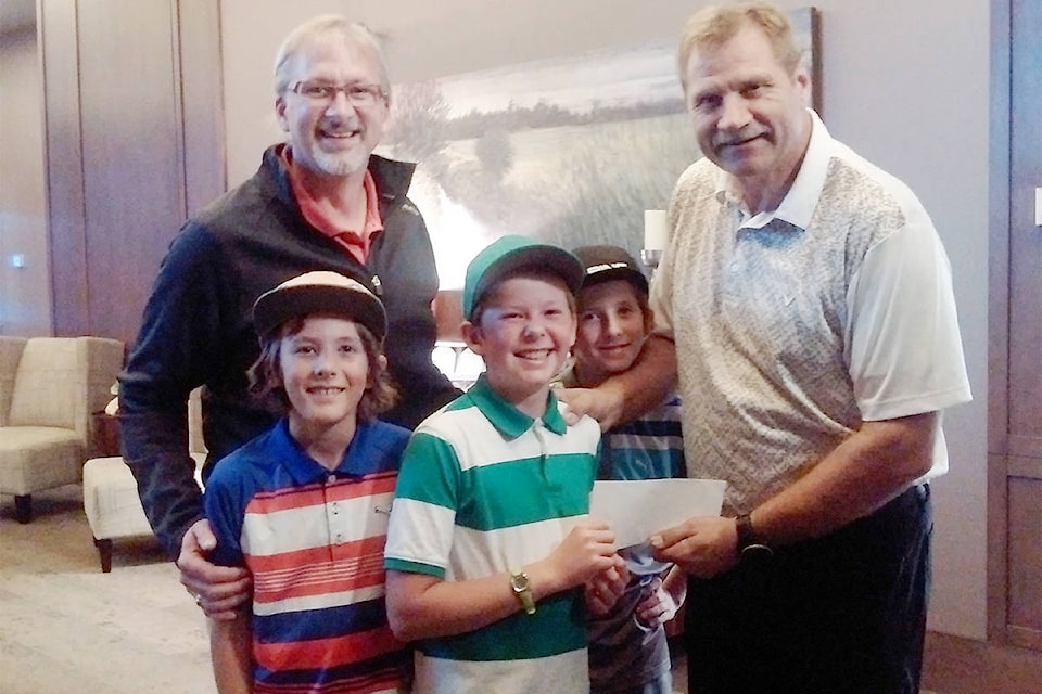 Cascade Par 3 Golf Course would like to say a huge thank-you to all who participated and made donations at the Golf with Significance charity golf event this past summer. A total of $6,450 was donated to Athletes in Action, a charity that supports kids and sports camps. Pictured, Gene Krahn with Austin, Mitchell and David handing the donation to Dave Klassen, national director of Athletes in Action. Thanks again to all who came out - your golf game was significant! (Gene Krahn/Submitted)