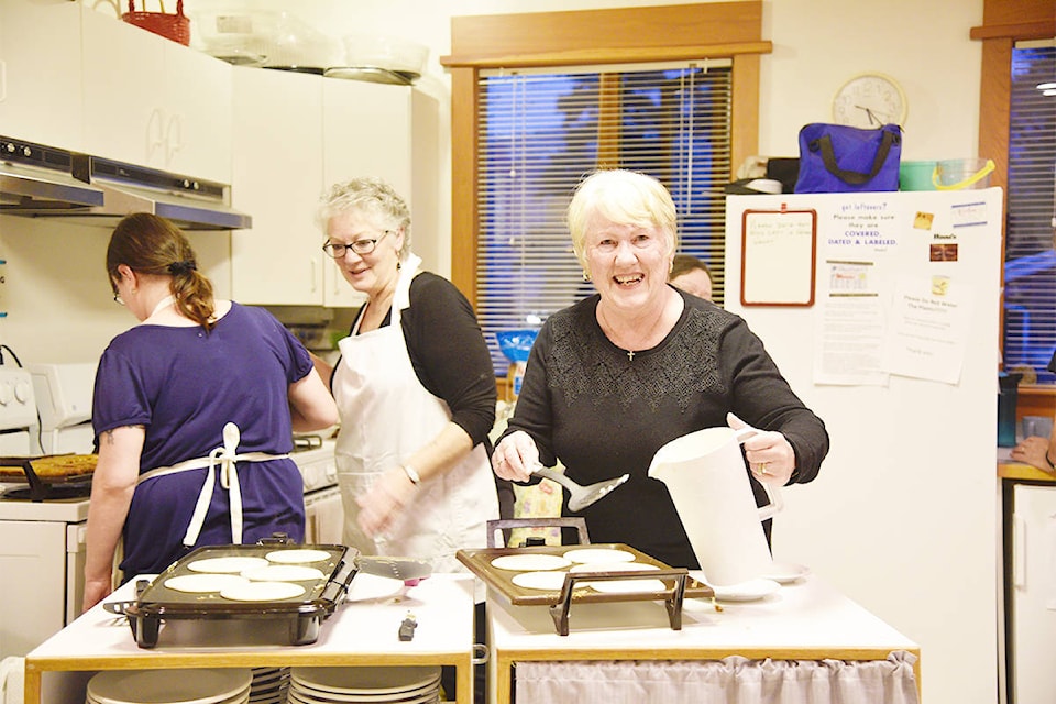 Holy Trinity Anglican Church hosted a pancake supper last Tuesday for Shrove Tuesday. The longstanding church tradition saw dozens of people turn out for all-you-can-eat pancakes, sausage and eggs, thanks to those hard at work behind the scenes (and behind the griddle.) (Kathleen Saylors/Grand Forks Gazette)