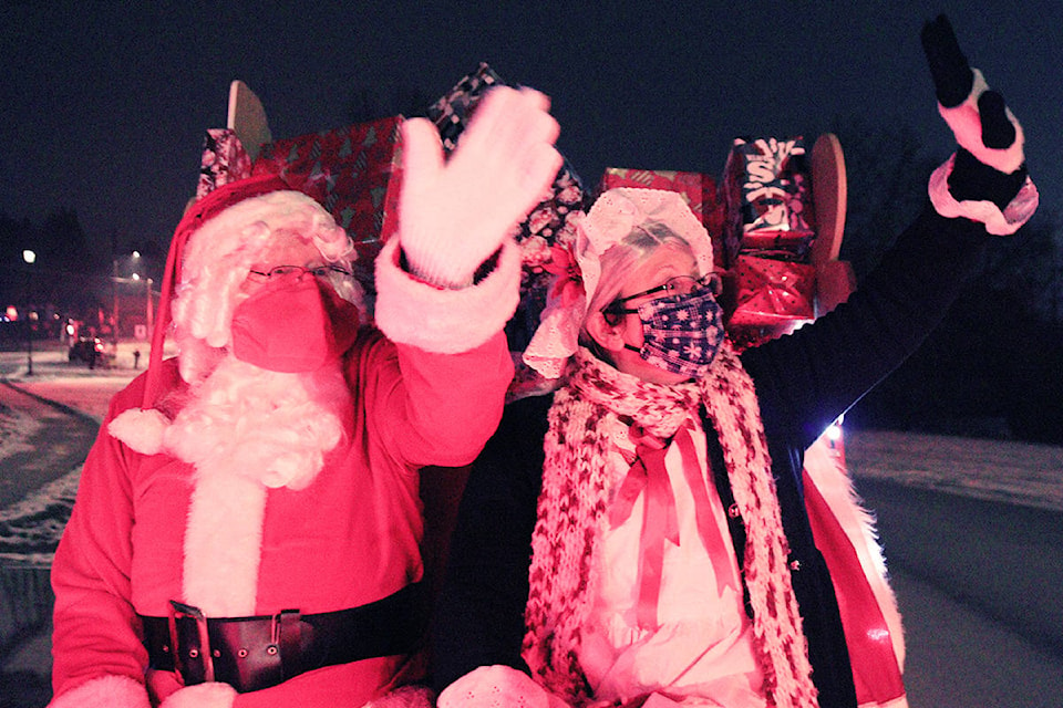 Santa and Mrs. Claus greeted scores of good little Grand Forks’ boys and girls at Friday’s Santa Parade, Dec. 4. Photo: Laurie Tritschler