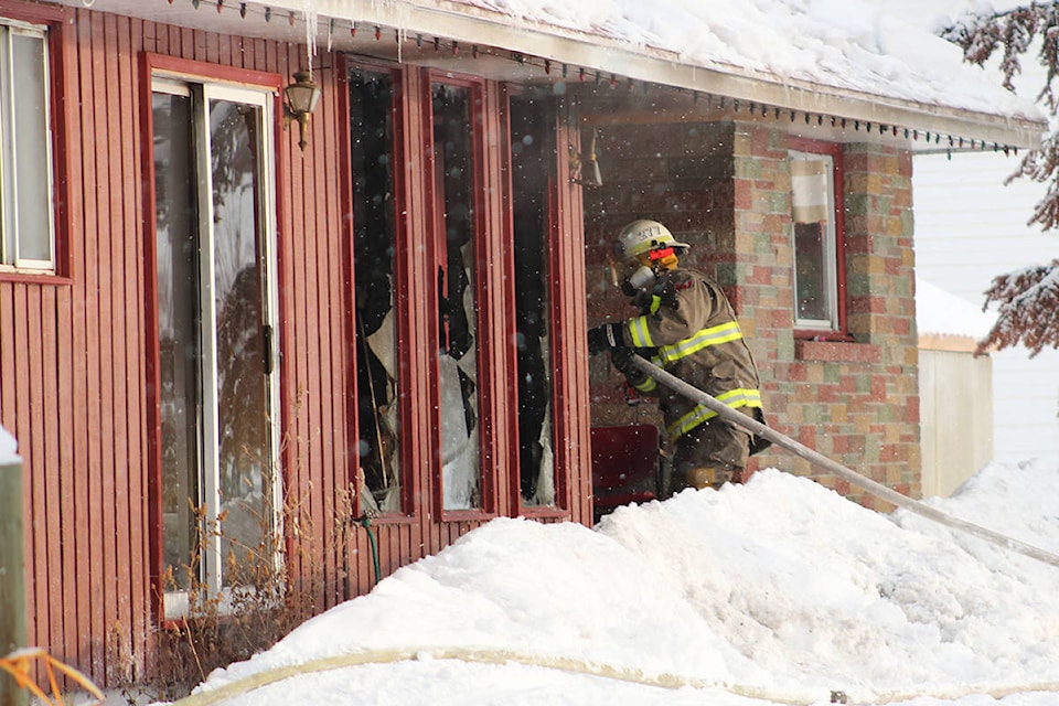 Grand Forks firefighters leaped into action at 3:38 a.m. on Jan. 15, when a call came in for a house fire at 27th Street and Central Avenue, near the Ramada Inn in Grand Forks. Photo: Jensen Edwards