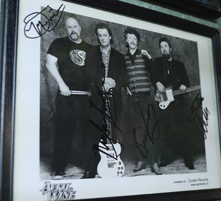 An autographed picture from the band April Wine hangs on a wall at the Tastie Treat. Photo: Laurie Tritschler