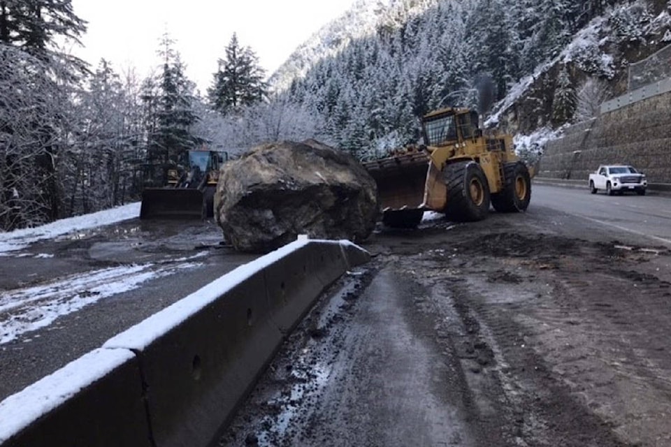 B.C. Transportation crews push a boulder off Highway 1 near Hell’s Gate on Monday morning. Traffic through Boston Bar and beyond was backed up throughout most of the morning heading into early afternoon. (Photo/B.C. Transportation)