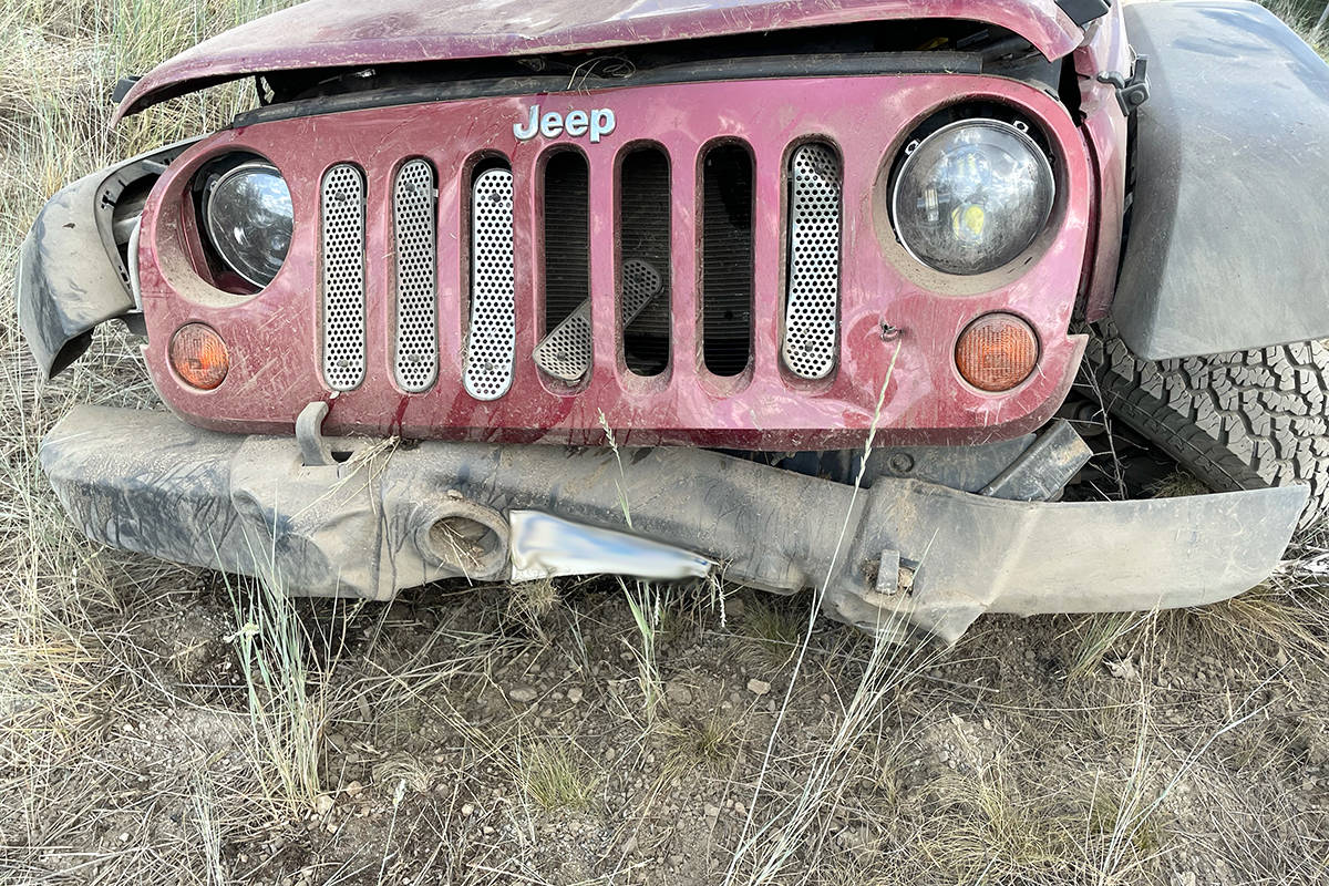 A close-up photo shows the Jeeps front drivers-side tire bent at nearly 180 degrees to the ground. Photo: Submitted