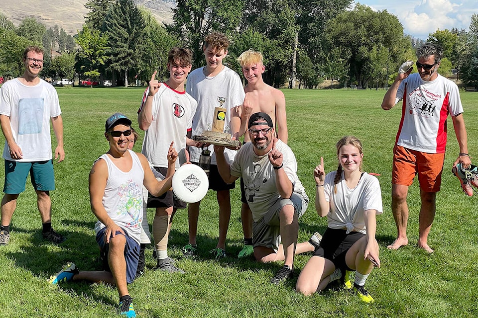 The Pistol Shrimps show off their Grand Forks Ultimate trophy after winning Saturday’s (Sept. 11) championships at City Park.