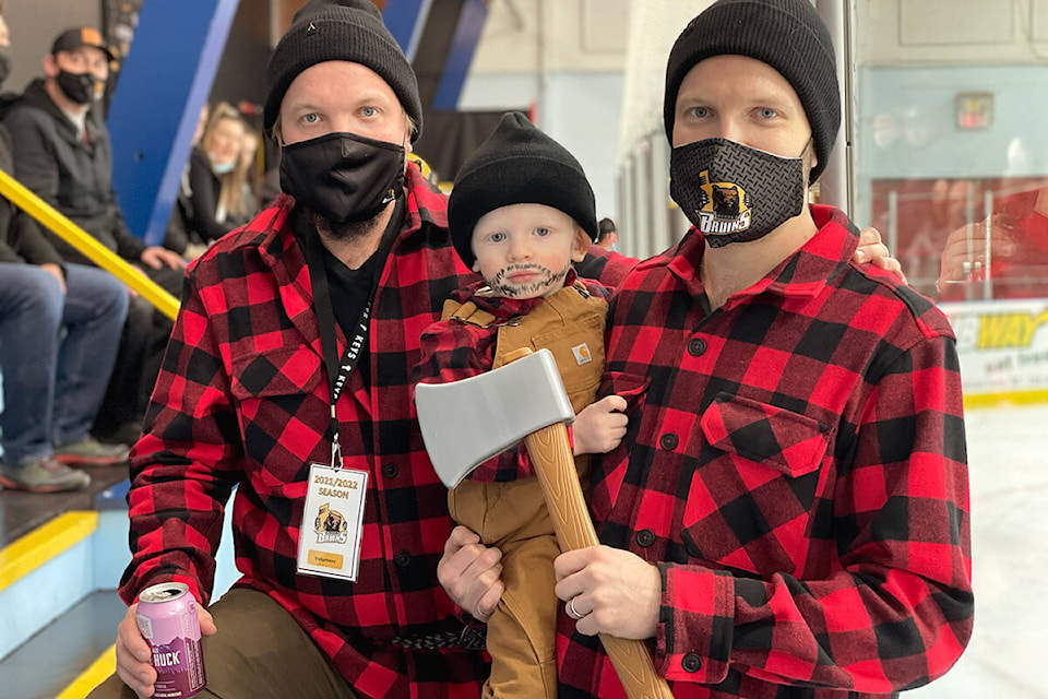 (L-R) Szynkaruks Danny, Theo and Bruins’ owner Mark show off their plaid during the first period. Photo: Laurie Tritschler
