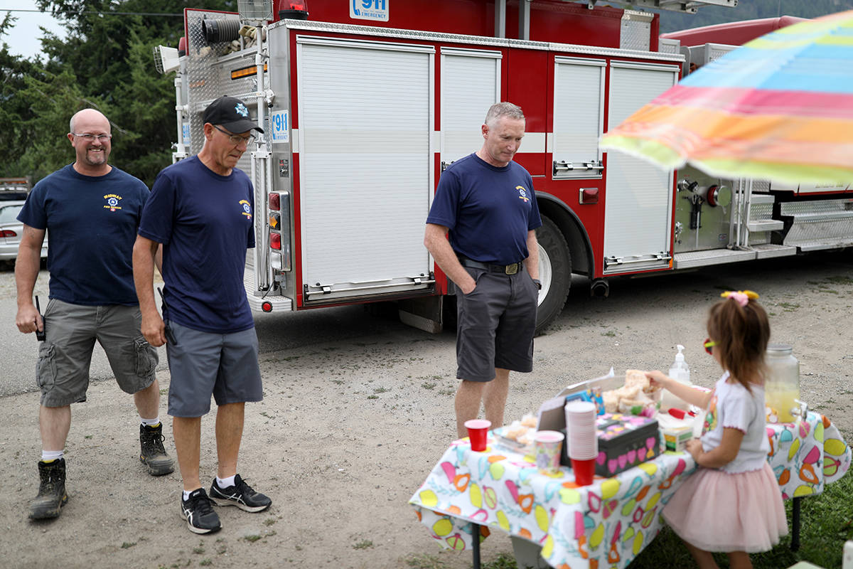 Midway firefighters and Chief Mike Daloise stop for lemonade at Finley Kamigochis department fundraiser, Aug. 7. Photo courtesy of Cam Kamigochi.