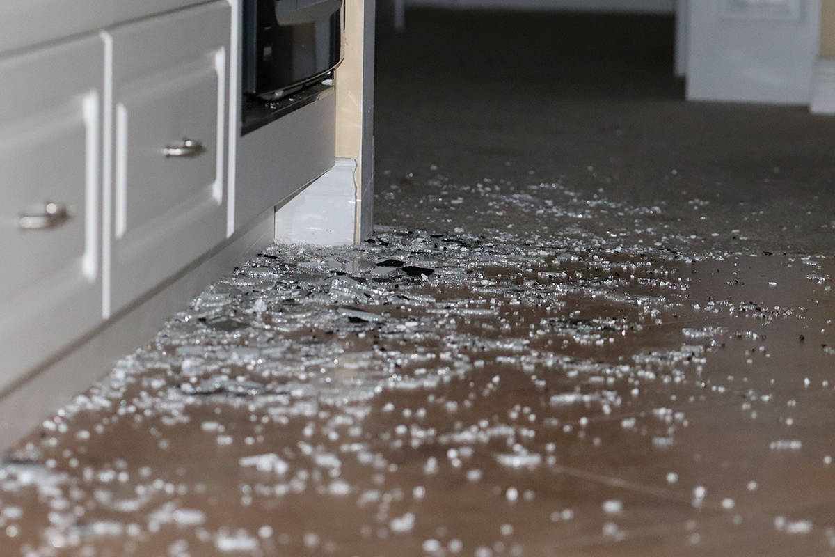 Shattered glass litters the kitchen floor at 7004 First Street, where thieves apparently broke a high-end cooking range. Photo: Laurie Tritschler