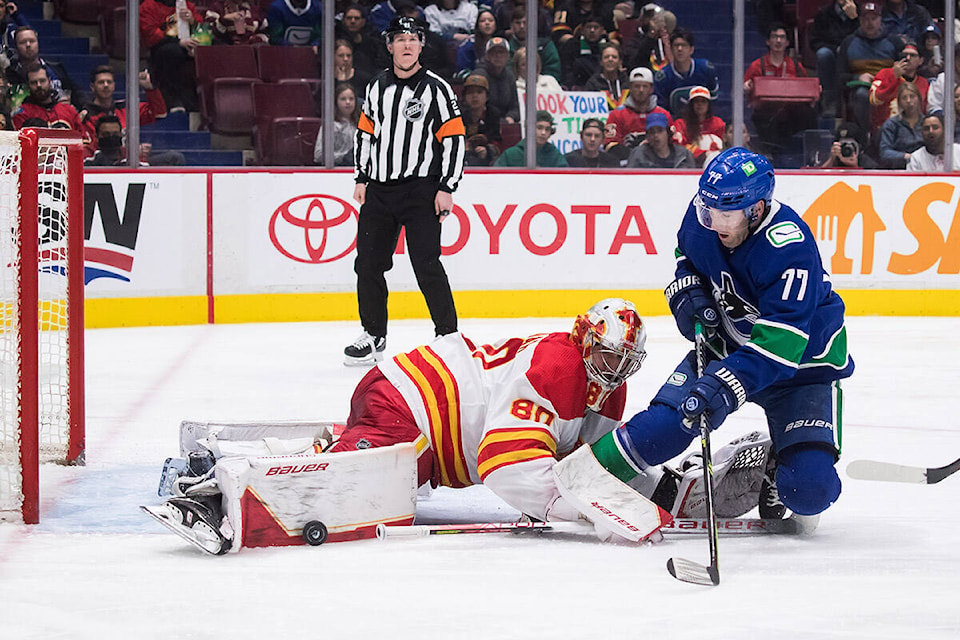 28521141_web1_220319-CPW-Flames-Canucks-canucks_1