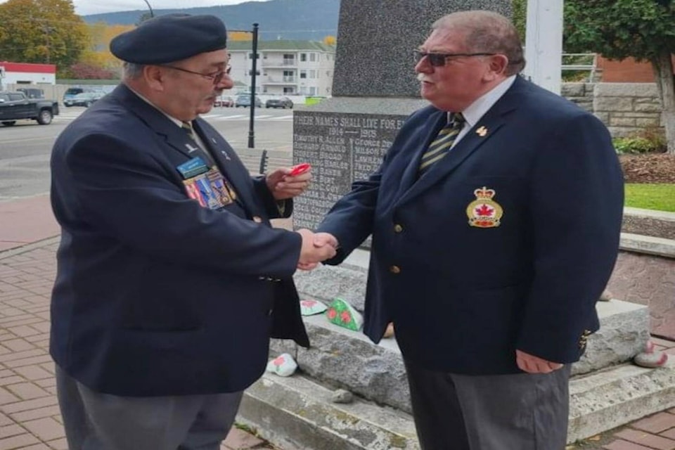 Ken Cruickshank (left) pinning the First Poppy on on Mayor Elect Everett Baker (right), Oct. 28. Photo provided by Ken Cruickshank