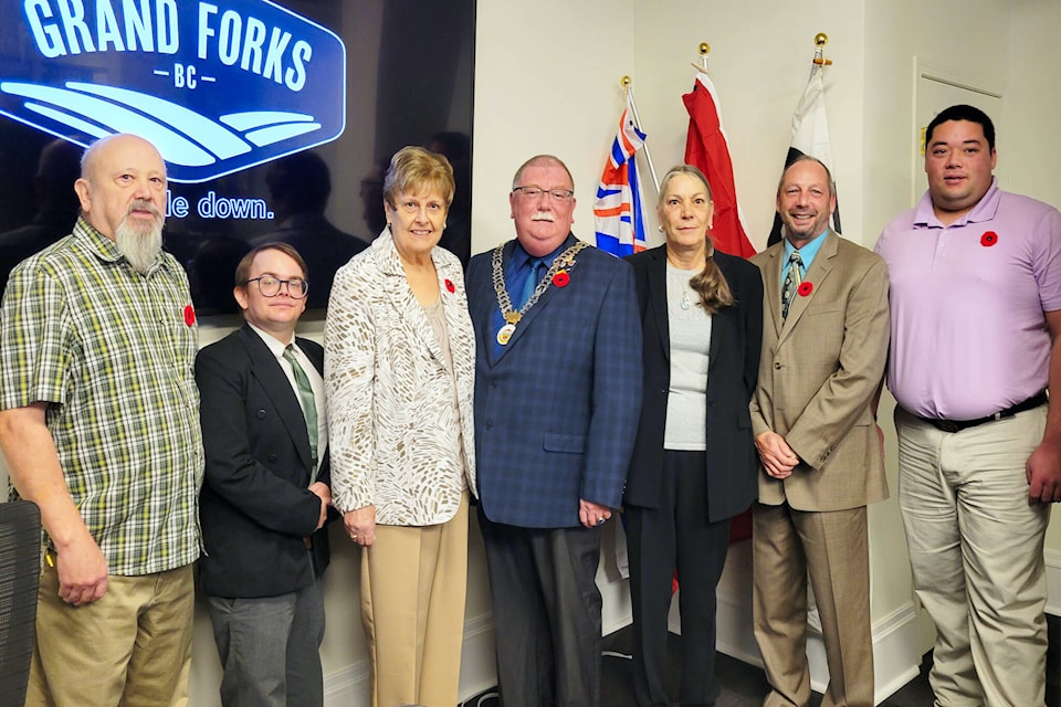 The City of Grand Forks’ new council. From L-R. Councillor Neil Krog, Councillor Zac Eburne-Stoodley, Councillor Christine Thompson, Mayor Everett Baker, Councillor Deborah LaFleur, Councillor Rod Zielinski, Councillor David Mark (photo by Chris Hammett).