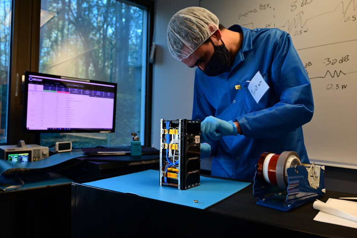Tristan Tarnowski, ORCASat team member and UVic engineering student, during assembly of the UVic satellite. (Courtesy ORCASat)