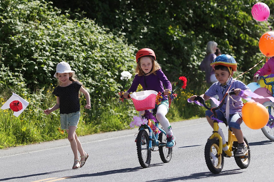 Kids on bikes got rolling well ahead of the Hospital Day parade as they zoomed down Oceanview Drive. (Andrew Hudson/Haida Gwaii Observer)