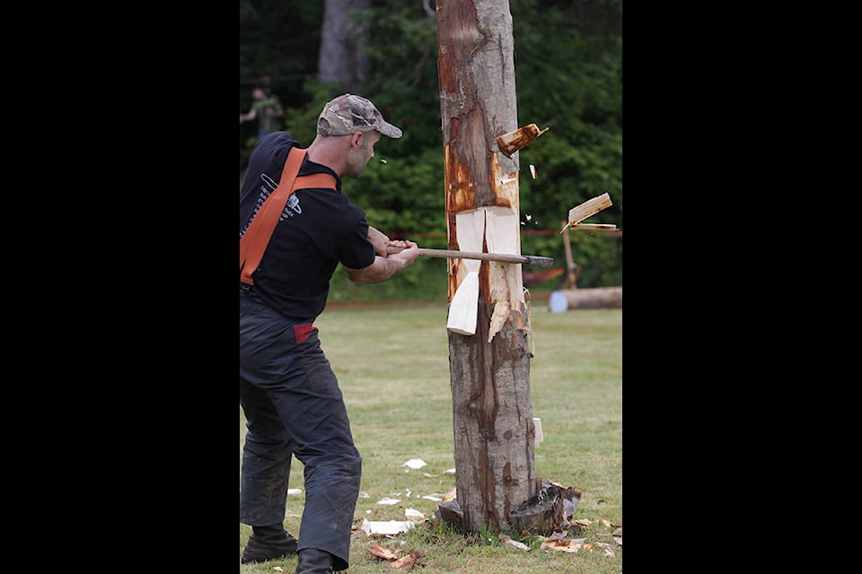 Chips fly as Shane Olson, winner of the Men’s Standing Chop, drives his axe on target. (Andrew Hudson/Haida Gwaii Observer)