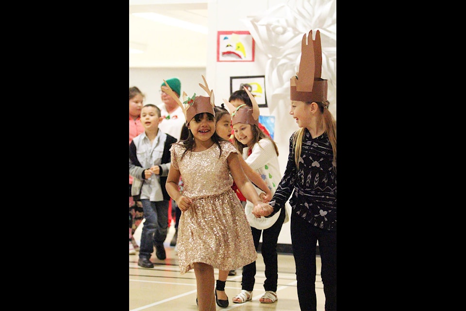 The whole school marched hand-in-hand to start off the night, with students’ artwork displayed around the gym. (Andrew Hudson/Haida Gwaii Observer)