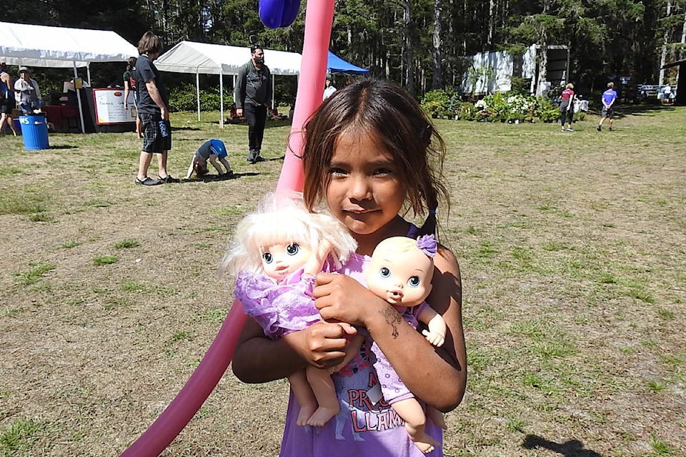 Little Elizabeth showing off her younger toy siblings.